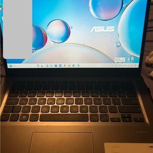 ASUS Silver Laptop with Black Keys